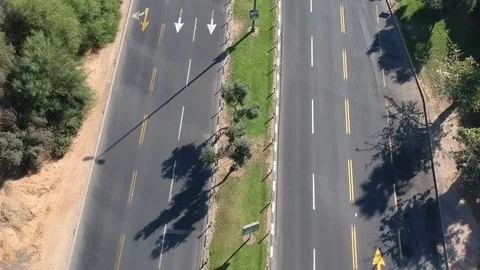 Top view of bicycle rider riding on main road Stock Footage