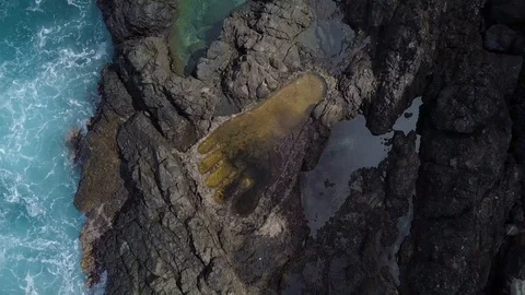 Top view of big footprint step in rock Stock Footage 113045949