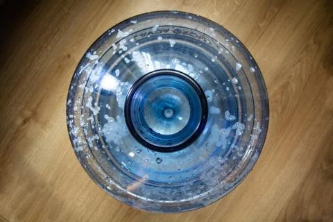 Top view on the big plastic bottle. Empty bottle for water cooler. Drops is o Stock Photos
