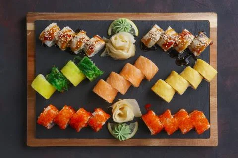 Top view of big set of rolls served on stone plate Stock Photos