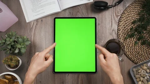 Top view. Big tab on the table with chromakey screen on it. Hands show thumbs up Stock Footage 129388698
