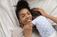 Top View Of Biracial Mom Hugging Little Baby Stock Photos