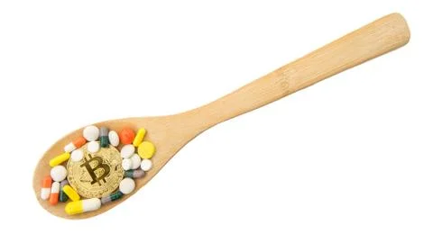 Top view of bitcoin, assorted pharmaceutical medicine pills, tablets on woode Stock Photos