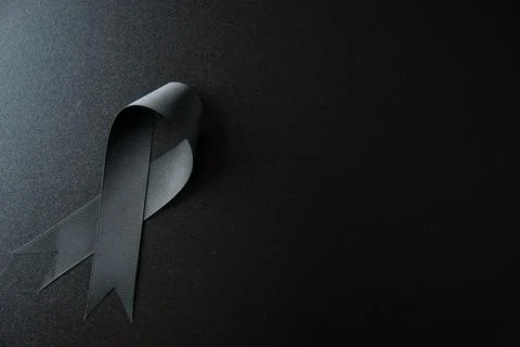 Top view of black bow on dark floor death war evil funeral tragedy Stock Photos