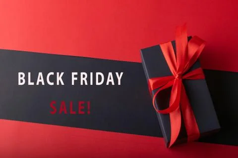 Top view of black boxes with red ribbon on black background and red backgroun Stock Photos