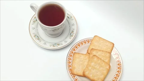 Top view black coffee cup and crispy crackers on white table Stock Footage 343510667