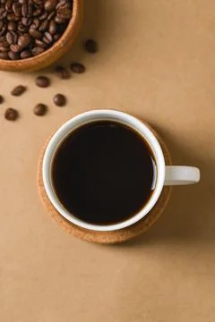Top view of black coffee with roasted beans and copy space Stock Photos