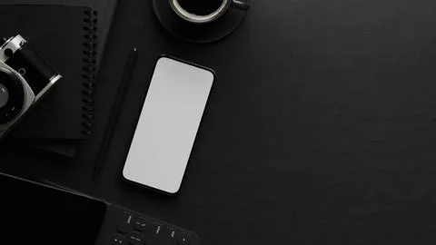 Top view of black desk with blank screen smartphone, vintage camera, notebo.. Stock Illustration