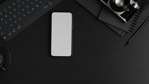 Top view of black desk setup with blank screen smartphone, keyboard, camera.. Stock Illustration