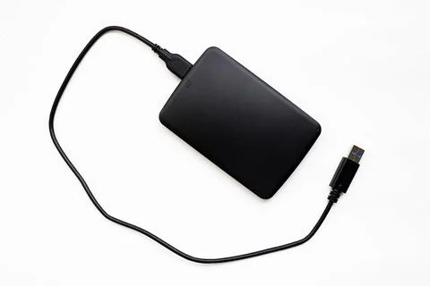 Top view of black external hard disk on white background Stock Photos