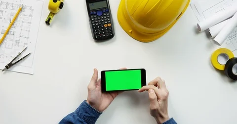 Top view on the black horizontal smartphone on the white table of the building Stock Footage 96184556