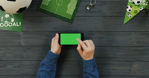 Top view on the black horizontal smartphone on the dark grey wooden desk of Stock Footage 96445382