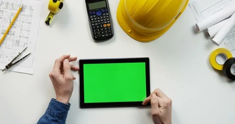 Top view on the black horizontal tablet device on the white table of the Stock-Footage 96184142