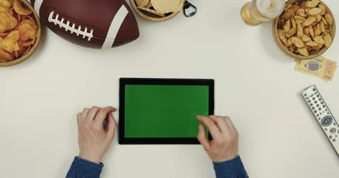Top view on the black horizontal tablet computer on the white desk with rugby Stock Footage 96326314