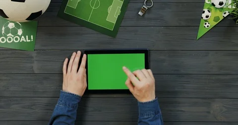 Top view on the black horizontal tablet computer on the dark grey wooden desk of Stock Footage 96440528
