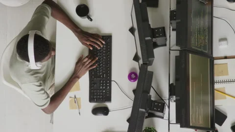 Top View of Black Male Programmer Coding in Office Stock Footage 255782924