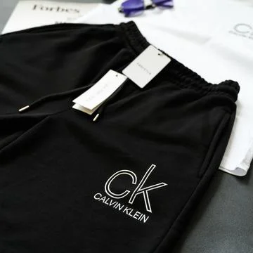 Top view of black men's drawstring shorts. New with tag. View from above. Squ Stock Photos