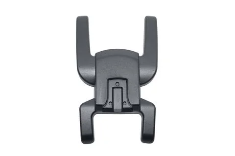 A top view of a black plastic camera flash hot shoe adapter mount isolated .. Stock Photos