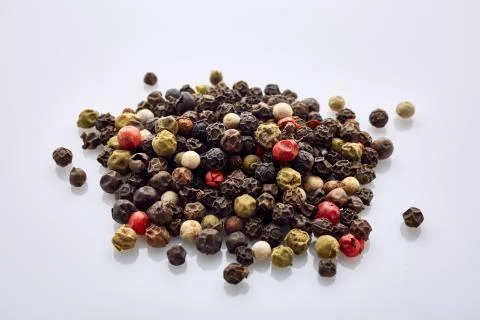 Top view on black, red and white peppercorns isolated on white background Stock Photos