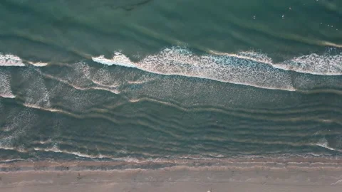 Top view of the Black Sea beach and waves shot on the shore of Mamaia, Romania. Stock Footage 234414094