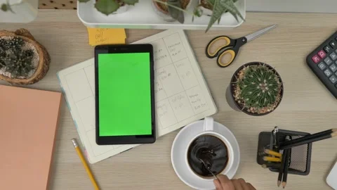 Top view of the black tablet computer lying horizontally on the wooden table. Ta Stock Footage 142224791