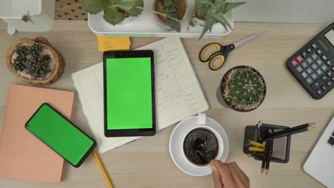Top view of the black tablet computer lying horizontally on the wooden table. Ta Stock Footage 143399271