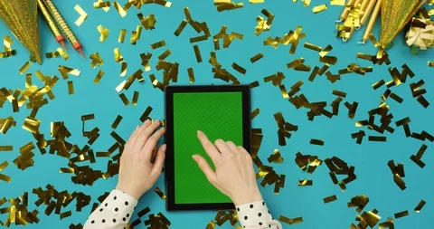 Top view on the black tablet device with green screen lying on the blue table Stock-Footage 89308552