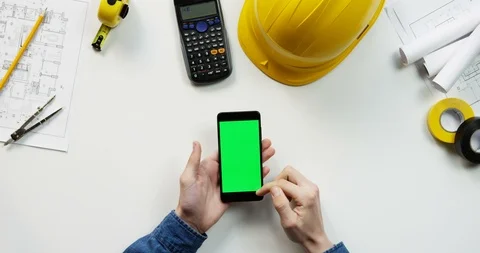 Top view on the black vertical smartphone on the white table of the building Stock Footage 96184521