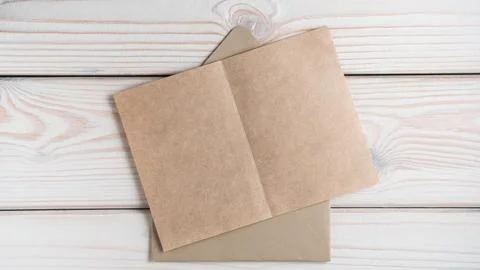 Top view of blank empty brown recycled craft paper on open craft envelope on  Stock Photos