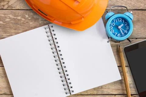 Top view with blank empty notebooks or notepad, alarm clock and pencil on woo Stock Photos