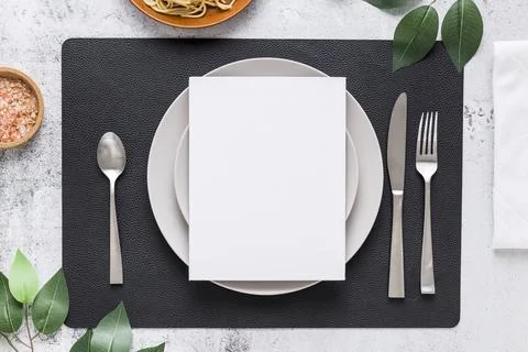 Top view blank menu paper plate with cutlery leaves Stock Photos