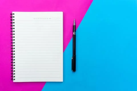 Top view blank notebook and black pen for mockup flat lay on blue and pink ba Stock Photos
