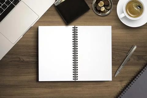 Top view of blank notebook memo on working desk among coffee cup and laptop Foto stock