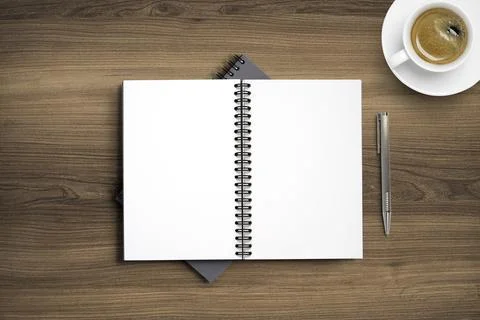 Top view of blank notebook memo on working desk among coffee cup and laptop Stock Photos