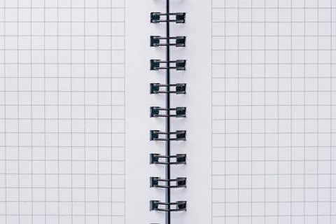 Top view of blank notebook page with black spiral and squares Stock Photos