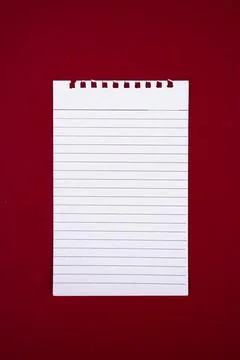 Top View of Blank Notebook page Isolated on Red Background for Notes Foto stock