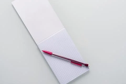 Top view of blank notebook with pencil on white background Stock Photos