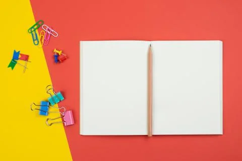 Top view of blank open notebook with pencil and stationery items Stock Photos