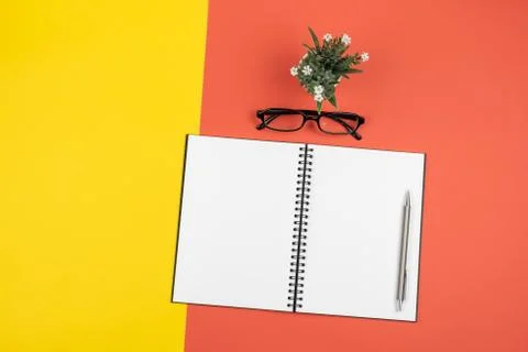 Top view of blank open notebook with pencil and stationery items and eyeglass Stock Photos