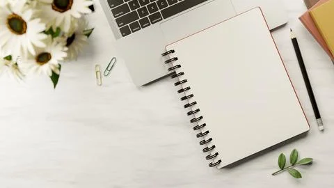 Top view of blank page notebook on laptop with books and pencil aside flowe.. Stock Illustration
