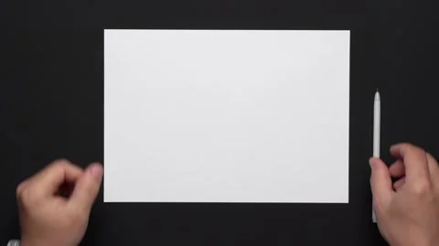 Top view of a blank sheet of paper and a businessman's hands Stock Footage 130784724