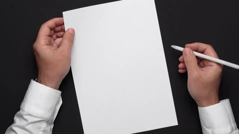 Top view of a blank sheet of paper and a businessman's hands Stock Footage 131048829