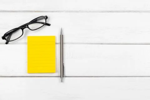 Top view of a blank sticky note with pencil Stock Photos