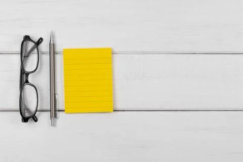 Top view of a blank sticky note with pencil Stock Photos