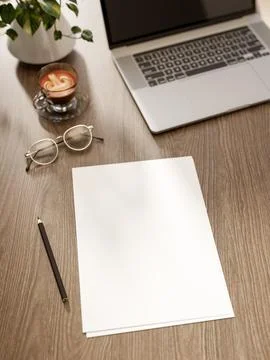 Top view of blank white papers with pencil and eyeglasses aside coffee and .. Stock Illustration