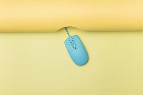 Top view blue computer mouse with yellow background Stock Photos