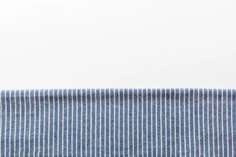 Top view with blue kitchen napkin isolated on table background. Folded cloth  Stock Photos