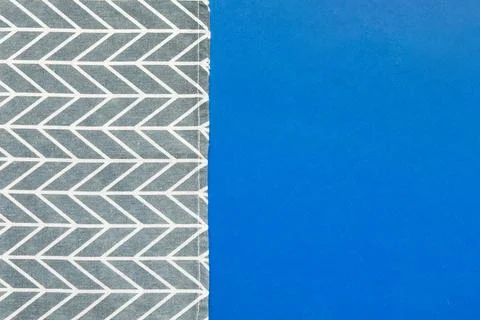 Top view with blue kitchen napkin isolated on table background. Folded cloth  Stock Photos