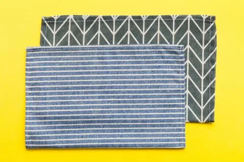 Top view with blue kitchen napkin isolated on table background. Folded cloth  Stock Photos