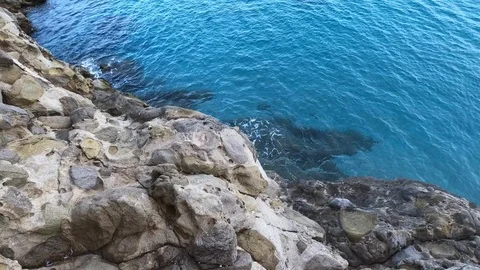 Top view off blue ocean waves crash coastline cliff Stock Footage 104921867